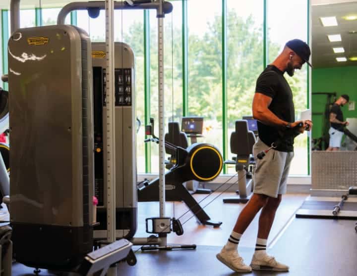 Man in gym on weight machine